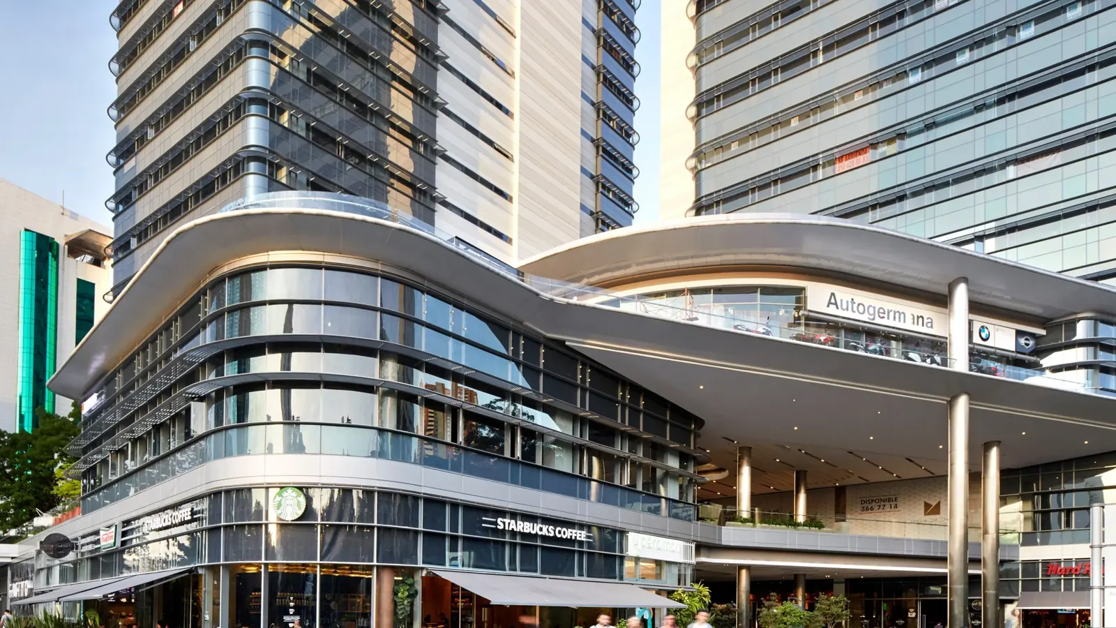 A modern commercial building in El Poblado, shops at street level